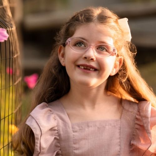 Little girl wearing sweet pink glasses