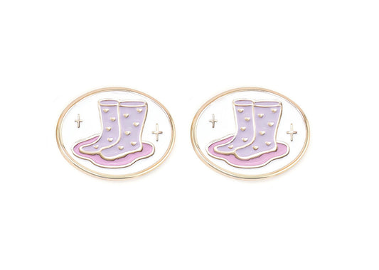 Pair of charms for girls eyeglasses with pink and purple rainboots design on a white background