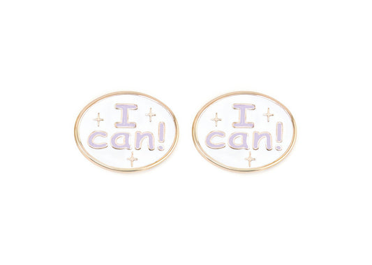 Pair of charms for girls eyeglasses with purple "I Can!" design on a white background