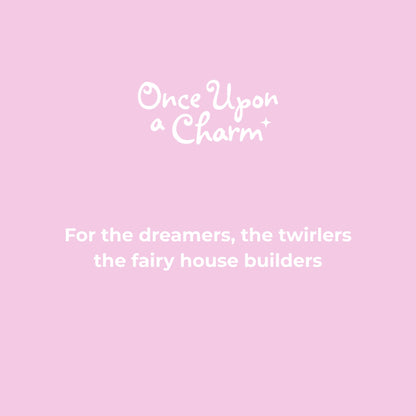Pink background with 'Once Upon a Charm' text and tagline