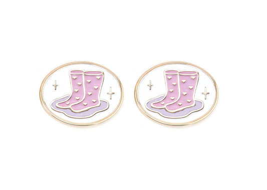 Pair of charms for girls eyeglasses with pink and purple rainboots design on a white background