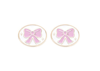 Pair of charms for girls eyeglasses with pink bow design on a white background