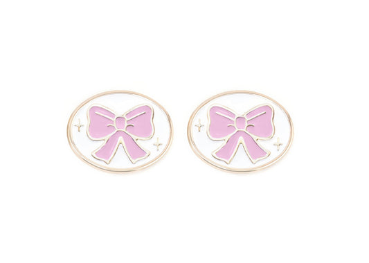 Pair of charms for girls eyeglasses with pink bow design on a white background