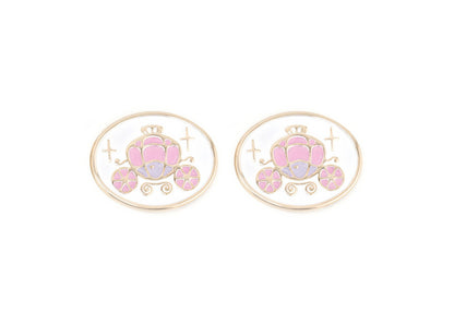 Pair of charms for girls eyeglasses with pink carriage design on a white background