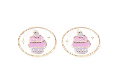 Pair of charms for girls eyeglasses with pink and purple cupcake design on a white background