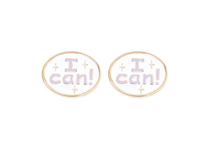 Pair of charms for girls eyeglasses with  purple "I Can!" design on a white background