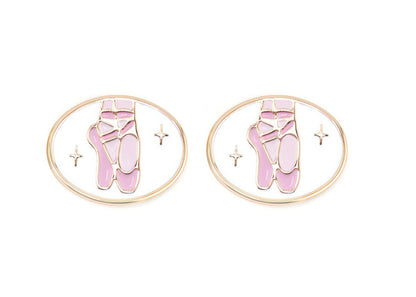 Pair of earrings with pink ballet shoes design on a white background